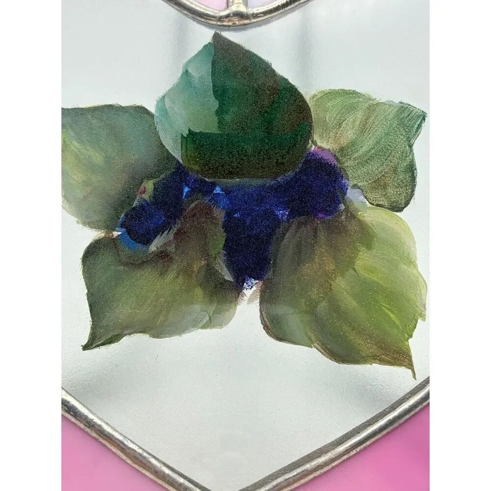 Stained glass heart. With a hand painted floral design.